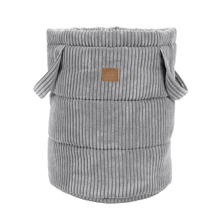 Empty grey corduroy toy storage basket with rope handles and ribbed texture