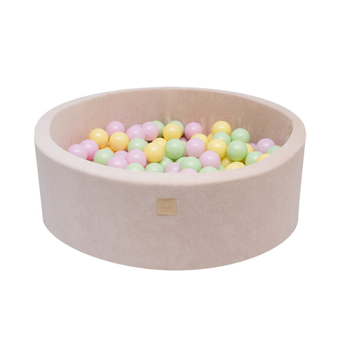 Product shot of 30 cm beige foam ball pit filled with colorful balls
