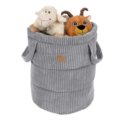 Grey corduroy storage basket filled with stuffed animals and toys