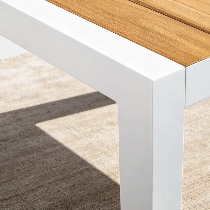 Close-up of the seamless corner joints on Peak Home Furnishings white powder-coated aluminum outdoor table frame.